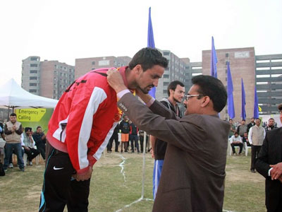 GETTING FELICITATED FOR RECORD-BREAKING VICTORY